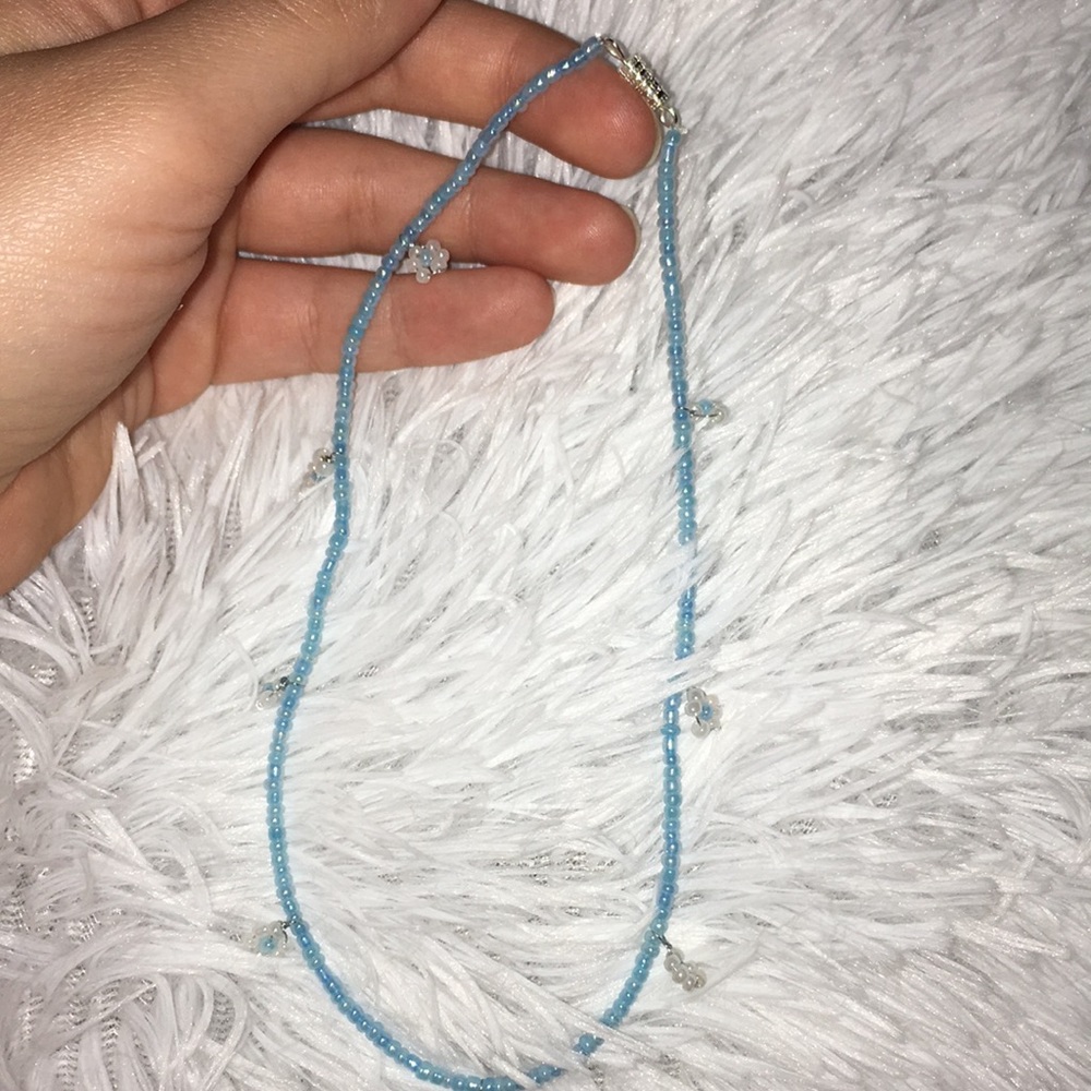 Seed bead choker with flowers made by my daughter.